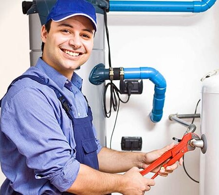 A plumber man fixing pipe with a smiling face