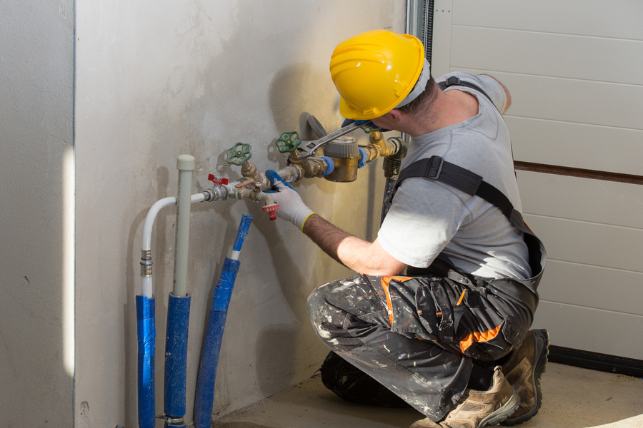 Licensed plumber working on plumbing repairs