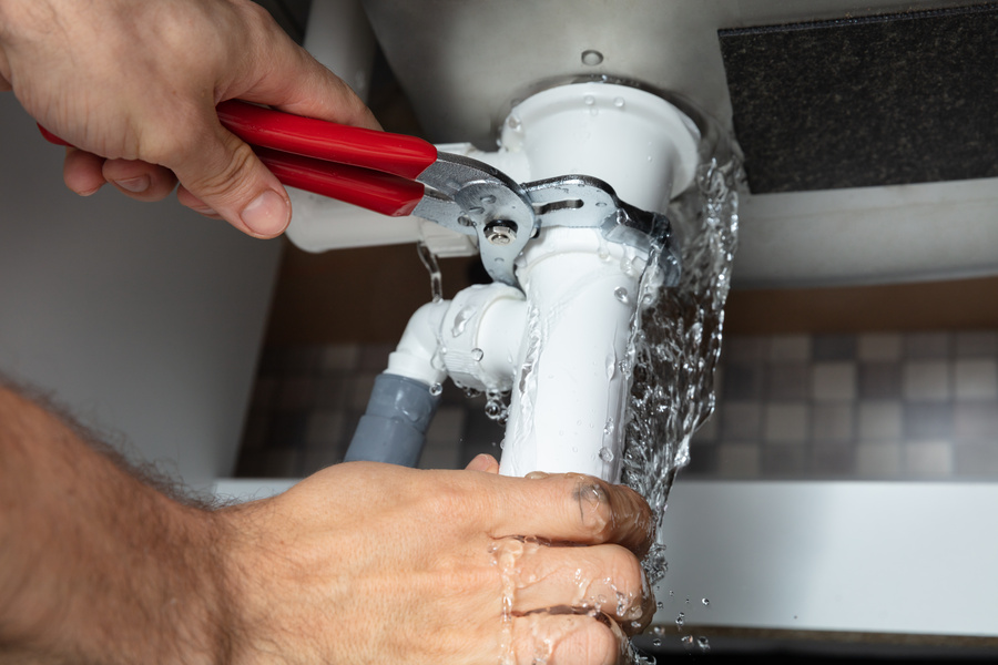 plumber fixing plumbing issue